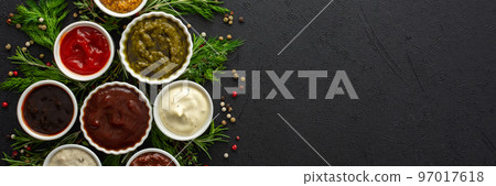 Sauces in bowls with seasonings 97017618