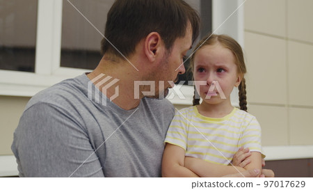 little girl was offended her dad. conversation between little child father. kid upset badly behaves without obeying parent. man explain his daughter rules conduct. tear baby eye. crying child dream 97017629