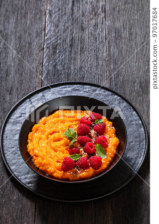 Sweet Potato Mash topped with fresh Raspberries Sweet Potato Mash topped with fresh Raspberries 97017684