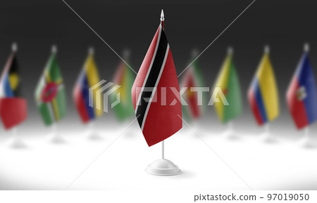 The national flag of the Trinidad and Tobago on the background of flags of other countries The national flag of the Trinidad and Tobago on the background of flags of other countries 97019050