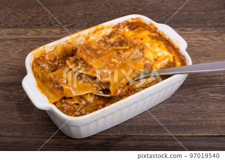 Lasagna with meat sauce with a spoon 97019540