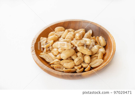 butter peanuts in a wooden bowl butter peanuts in a wooden bowl 97020471