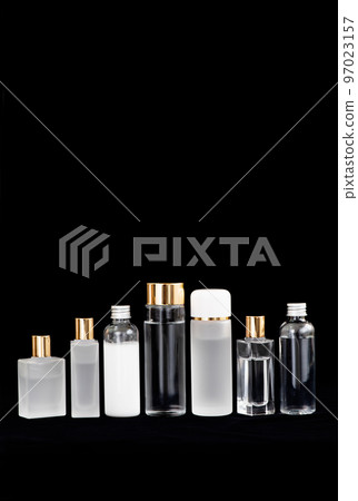 Alignment of 7 cosmetic bottles made of glass and plastic 97023157