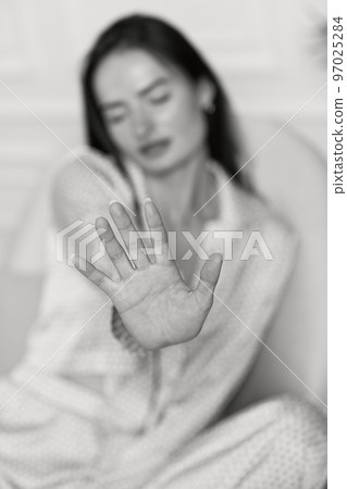 woman showing stop gesture. black and white 97025284