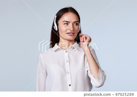woman in headset is consulting clients online. woman in headset is consulting clients online. 97025289