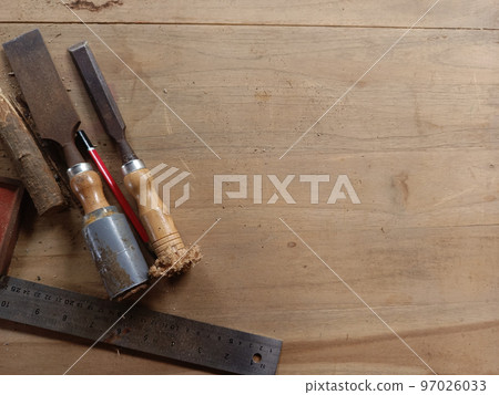 Carpenter wood working tools laying on wooden table. Industrial wood working materials. Carpenter wood working tools laying on wooden table. Industrial wood working materials. 97026033