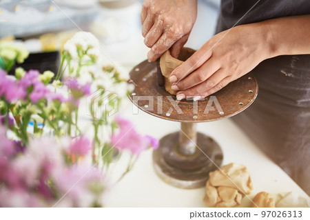 Female potter creating a bowl.Hands of making clay pot. Craftsman Artist Pottery Skill Workshop Concept . 97026313