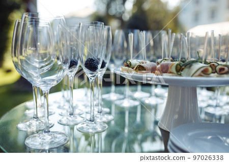 Champagne glasses on gold background. Party and holiday celebration concept Champagne glasses on gold background. Party and holiday celebration concept 97026338