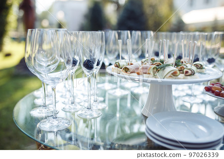 Champagne glasses on gold background. Party and holiday celebration concept Champagne glasses on gold background. Party and holiday celebration concept 97026339