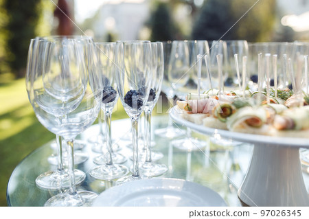 Champagne glasses on gold background. Party and holiday celebration concept Champagne glasses on gold background. Party and holiday celebration concept 97026345