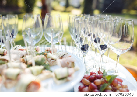 Champagne glasses on gold background. Party and holiday celebration concept Champagne glasses on gold background. Party and holiday celebration concept 97026346