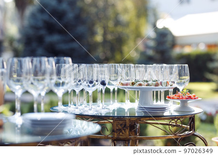 Champagne glasses on gold background. Party and holiday celebration concept Champagne glasses on gold background. Party and holiday celebration concept 97026349