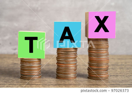 TAX alphabet on stack of coins money, business, banking, account, investment and finance concept. 97026373