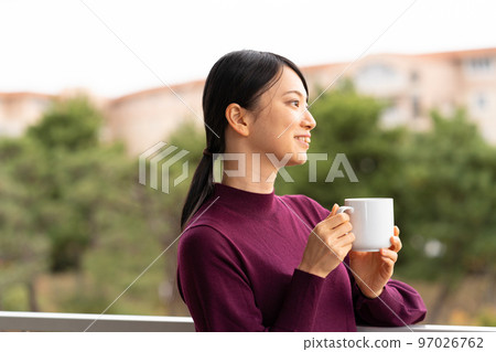 Woman relaxing on the hotel terrace 97026762