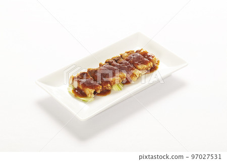 slice crispy roasted pork on plate on white background. 97027531