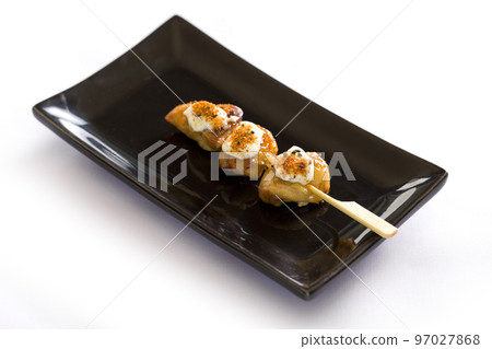 Various kind of grilling kushiyaki or meat skewers on white background. Japanese style skewered food in the izakaya restaurant. Various kind of grilling kushiyaki or meat skewers on white background. Japanese style skewered food in the izakaya restaurant. 97027868