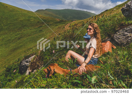 Mother Son and Vizsla Dog Resting in Mountains Mother Son and Vizsla Dog Resting in Mountains 97028468