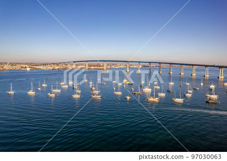 Empty sailboats docked in San Diego bay in front of Coronado Bridge Empty sailboats docked in San Diego bay in front of Coronado Bridge 97030063