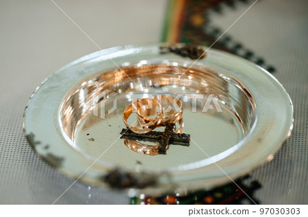 Gold rings of newlyweds, wedding accessories, rings close-up. Gold rings of newlyweds, wedding accessories, rings close-up. 97030303