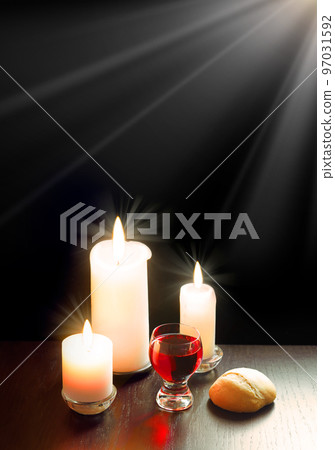 A bowl of wine and bread on the table. Communion symbols A bowl of wine and bread on the table. Communion symbols 97031592