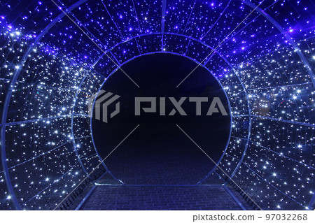 tunnel and illuminations of blue white on a black dark background. New Year's Eve Christmas. Photoona festive atmosphere tunnel and illuminations of blue white on a black dark background. New Year's Eve Christmas. Photoona festive atmosphere 97032268