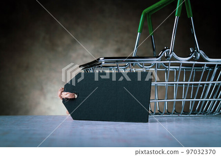 Shopping cart and empty price tag for inscription. The price of the product. Sale in the grocery store. 97032370