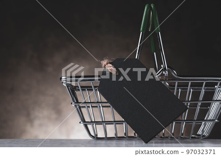 Shopping cart and empty price tag for inscription. The price of the product. Sale in the grocery store. 97032371