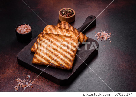 Tasty fresh crispy bread slices in the form of grilled toast 97033174