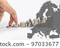 Fingers step on a stack of coins and Europe map. The concept of the energy crisis 97033677