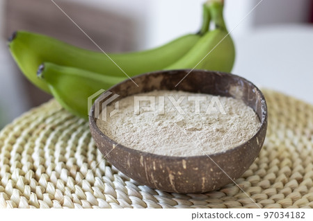 Banana flour made from green bananas on a woven hyacinth cinnamon 97034182