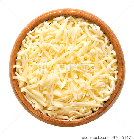 Shredded mozzarella cheese, in a wooden bowl. Grated low-moisture part-skim mozzarella, an Italian cheese, made of pasteurized cow milk, rolled in starch to avoid sticking. Used for pizza and pasta. 97035147