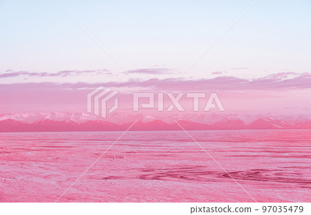Winter landscape with mountains and Lake Baikal in Siberia at sunset. Natural background. Toned image in trendy magenta color of year 2023. Winter landscape with mountains and Lake Baikal in Siberia at sunset. Natural background. Toned image in trendy magenta color of year 2023. 97035479