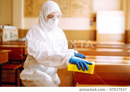 Cleaning and disinfection school desk during coronavirus pandemic. COVID-19. Cleaning and disinfection school desk during coronavirus pandemic. COVID-19. 97037937