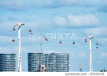 London, UK. May 10, 2022. View of the Emirates Cable car in London England across river Thames. London, UK. May 10, 2022. View of the Emirates Cable car in London England across river Thames. 97038546