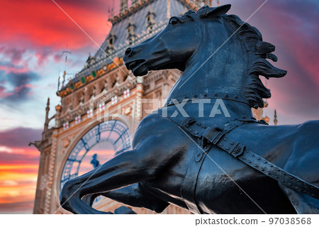 Close up view of the Big Ben clock tower and horse statue monument in the foreground. Amazing details after renovation of the Big Ben. Close up view of the Big Ben clock tower and horse statue monument in the foreground. Amazing details after renovation of the Big Ben. 97038568