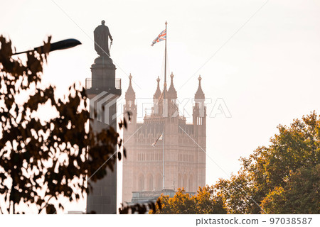 The very symbol of London. Westminster Abby with UK flag and Duke of York monument. Symbols of London. The very symbol of London. Westminster Abby with UK flag and Duke of York monument. Symbols of London. 97038587