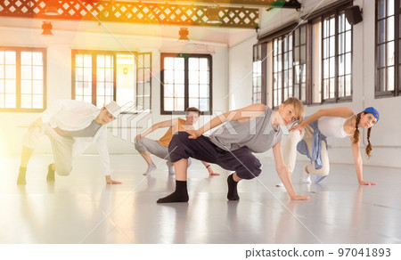 Group teenagers dancing hip-hop indoors 97041893