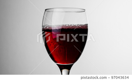 Red wine being poured into a glass Alcohol image Red wine being poured into a glass Alcohol image 97043634
