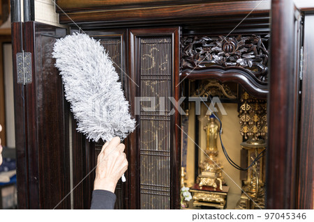 Cleaning the Buddhist altar Dust off with a duster 97045346
