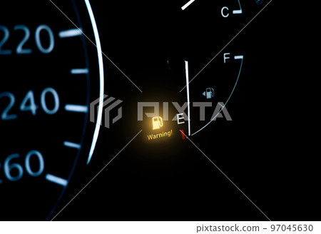 Low fuel indicator light on car dashboard 97045630