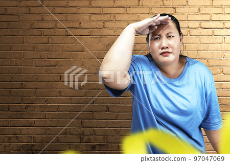 Asian fat overweight woman looking at something Asian fat overweight woman looking at something 97047069