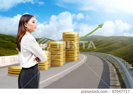Asian businesswoman standing with folded arms on an increasing coin graph arrow 97047717