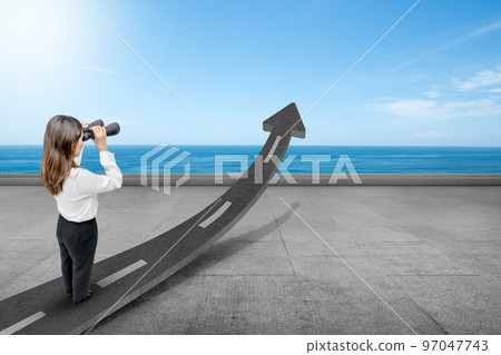 Asian businesswoman looking street arrow through binoculars 97047743