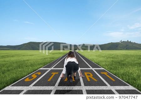Asian businesswoman in start position ready to run on the track Asian businesswoman in start position ready to run on the track 97047747