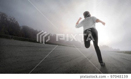 Rear view of Asian businessman running 97048139