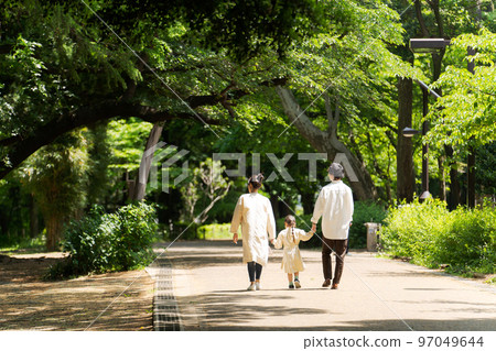 Families walking in the park 97049644