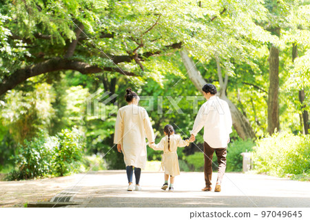 Families walking in the park 97049645