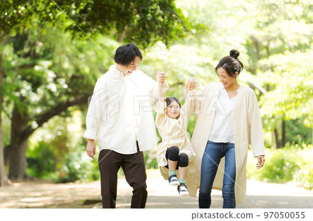 Families walking in the park Families walking in the park 97050055