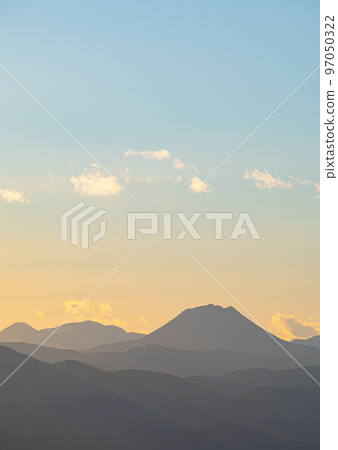 Pale gradation sky and mountain ridge silhouette. Mount Oakan in Hokkaido. Pale gradation sky and mountain ridge silhouette. Mount Oakan in Hokkaido. 97050322