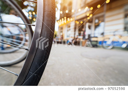 Bike Wheels close up on the street Bike Wheels close up on the street 97052598
